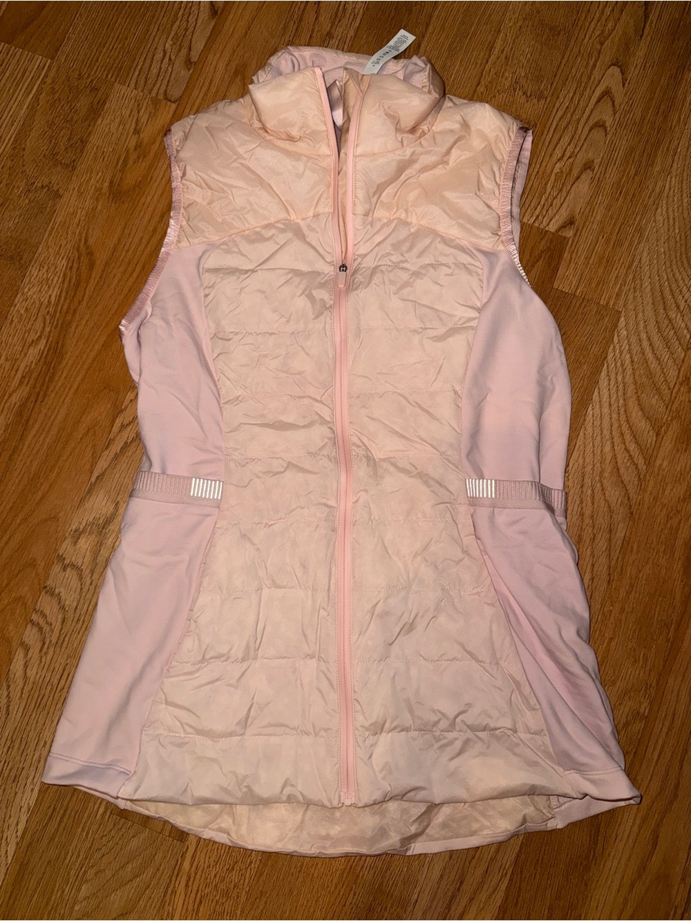 Women’s Lululemon pink puffer vest athletic apparel